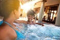 Happiness is treating yourself every now and then. Shot of two young women relaxing in a jacuzzi. Royalty Free Stock Photo