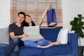 The happiness of the wife and husband together to order online products on the Internet to be delivered to their home on time. Royalty Free Stock Photo