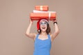 Happiness woman holding gift box in her head and smiling Royalty Free Stock Photo