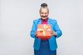 Happiness woman holding red gift box and toothy smiling Royalty Free Stock Photo