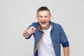 Happiness young boy pointing finger at camera and toothy smile. Royalty Free Stock Photo