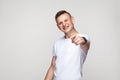 Happiness young boy pointing finger at camera and toothy smiling Royalty Free Stock Photo