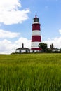 Happisburgh lighthouse in front of crops.