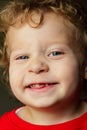 Happy 2 yr old blond boy who lost a front tooth Royalty Free Stock Photo