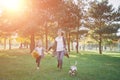 Happy abstract: mother and daughter run in city park