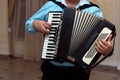 Happy accordion musician playing at wedding reception, hand on h Royalty Free Stock Photo