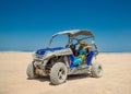 Female driving Atv in desert