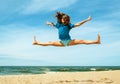 Happy active girl jumping at the beach Royalty Free Stock Photo