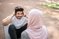 Muslim man training abs while woman holding his feet Royalty Free Stock Photo