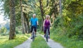 Happy and active senior couple riding bicycles outdoors in the p Royalty Free Stock Photo