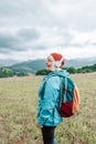 Happy active senior tourist woman listening to music in outdoor leisure trip admiring the landscape feeling inspired by Royalty Free Stock Photo