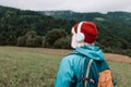 Happy active senior tourist woman listening to music in outdoor leisure trip admiring the landscape feeling inspired by Royalty Free Stock Photo