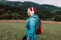 Happy active senior tourist woman listening to music in outdoor leisure trip admiring the landscape feeling inspired by Royalty Free Stock Photo