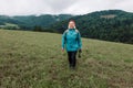 Happy active senior tourist woman listening to music in outdoor leisure trip admiring the landscape feeling inspired by Royalty Free Stock Photo