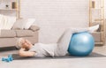 Happy active senior woman doing exercises with fitness ball Royalty Free Stock Photo