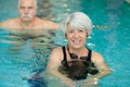happy active senior woman swimming in pool Royalty Free Stock Photo