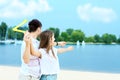 Young couple throwing boomerang. Summer outdoor activities