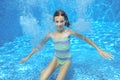 Happy active underwater child swims in pool Royalty Free Stock Photo