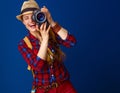 Happy active woman hiker with modern DSLR camera taking photo Royalty Free Stock Photo