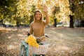 Happy active woman riding bicycle in autumn park Royalty Free Stock Photo