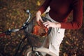 Happy active young woman riding bicycle in autumn park Royalty Free Stock Photo