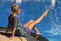 Beautiful young adult blonde girl on vacation at the resort