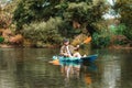 Happy adult caucasian man kayaking at the river. Copy space. The concept of the World Tourism Day Royalty Free Stock Photo