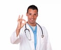 Happy adult doctor with ok fingers