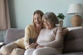 Happy adult granddaughter and elder grandma talking on video call Royalty Free Stock Photo