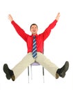 Happy adult man on chair isolated