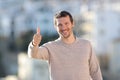 Happy adult man gesturing thumbs up in a rural town Royalty Free Stock Photo