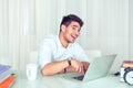 Cheerful smart man with laptop in office Royalty Free Stock Photo