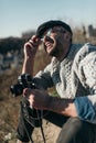 happy adult man with vintage film camera sitting Royalty Free Stock Photo