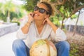 Happy adult woman portrait smiling cheerful outdoor at the park with globe earth thinking and dreaming next travel trip