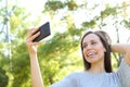 Happy adult woman taking selfies with smart phone Royalty Free Stock Photo
