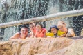 Happy adults and children in a water park Royalty Free Stock Photo