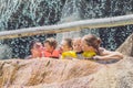 Happy adults and children in a water park Royalty Free Stock Photo