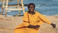 Happy Africa Ghana woman on the beach in Accra