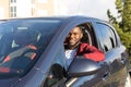 Happy African American in a blue car Royalty Free Stock Photo