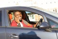 Happy African American in a blue car Royalty Free Stock Photo