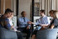 Happy African American boss shaking hands with young employee Royalty Free Stock Photo