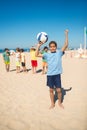 Happy African American boy with ball over head Royalty Free Stock Photo