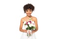 Happy african american bride holding bouquet and looking at camera Royalty Free Stock Photo