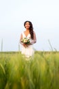 Portrait of happy african-american bride standing in a field Royalty Free Stock Photo