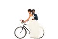 Happy african american bridegroom near cheerful bride riding bicycle Royalty Free Stock Photo