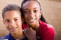 Happy African American brother and sister smiling. Royalty Free Stock Photo
