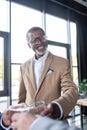 happy african american businessman clinking glasses Royalty Free Stock Photo