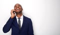 Happy african american businessman talking on cellphone against isolated white background Royalty Free Stock Photo