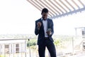 Happy african american businessman using tablet outside modern office Royalty Free Stock Photo