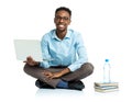 Happy african american college student with laptop, books and bo Royalty Free Stock Photo